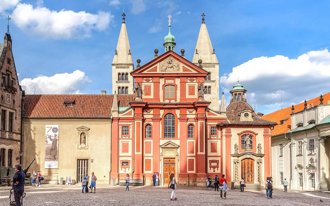 Red facade of St George’s Basilica in the Prague Castle courtyard